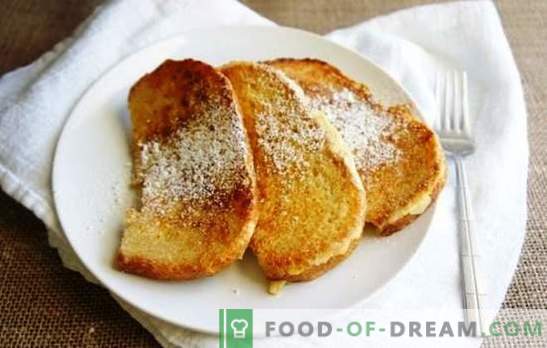 Duona piene keptuvėje, saldus, aštrus ir sultinys. Kepkite ruddy duonos skrudintuvus į pieną į keptuvę